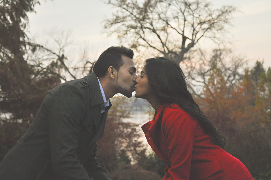 Engaged Couple kissing in the park