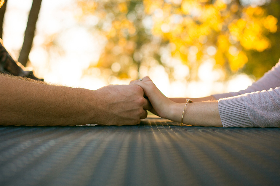 Engaged Couple holding hands